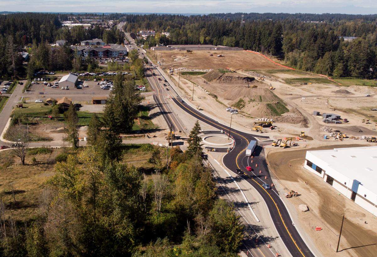 Construction crews work on a roundabout at State Route 410 and 224th Avenue East, on Tuesday, Oct. 1, 2024, in Bonney Lake.