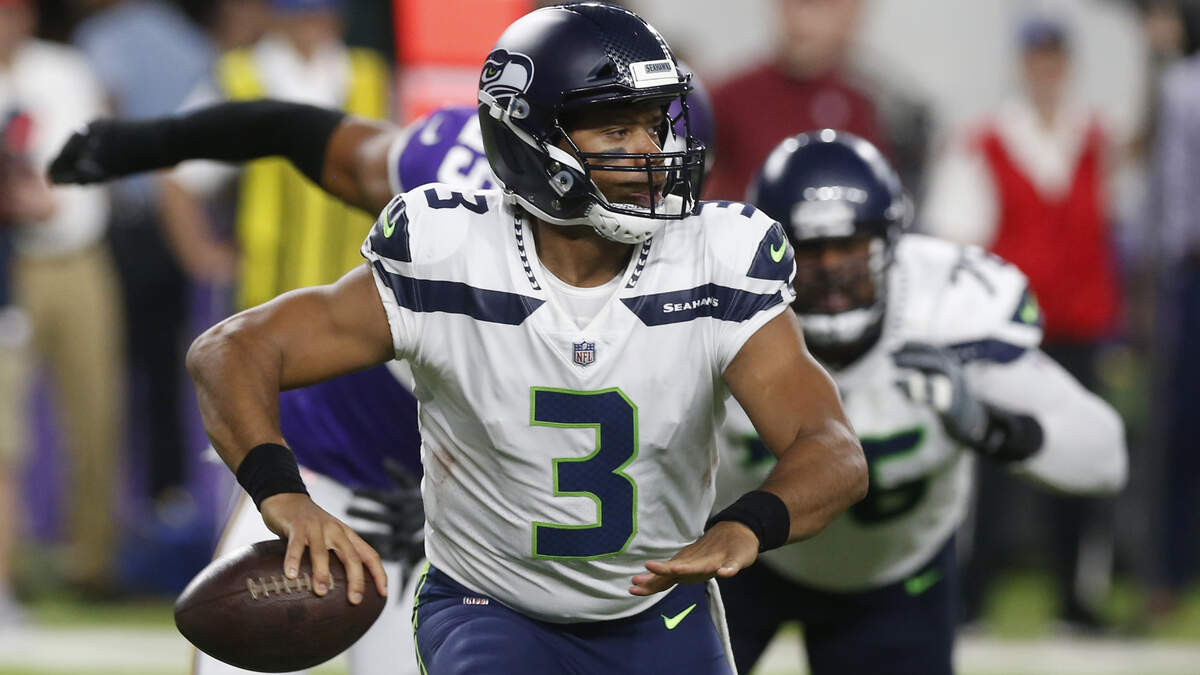 FILE - In this Friday, Aug. 24, 2018, file photo, Seattle Seahawks quarterback Russell Wilson looks to throw a pass during the second half of an NFL preseason football game against the Minnesota Vikings, in Minneapolis. While star power still remains led by Wilson, receiver Doug Baldwin and linebacker Bobby Wagner, the rest of the roster likely has too many holes for the Seahawks to be able to challenge the top teams in the NFC. (AP Photo/Jim Mone, File)
