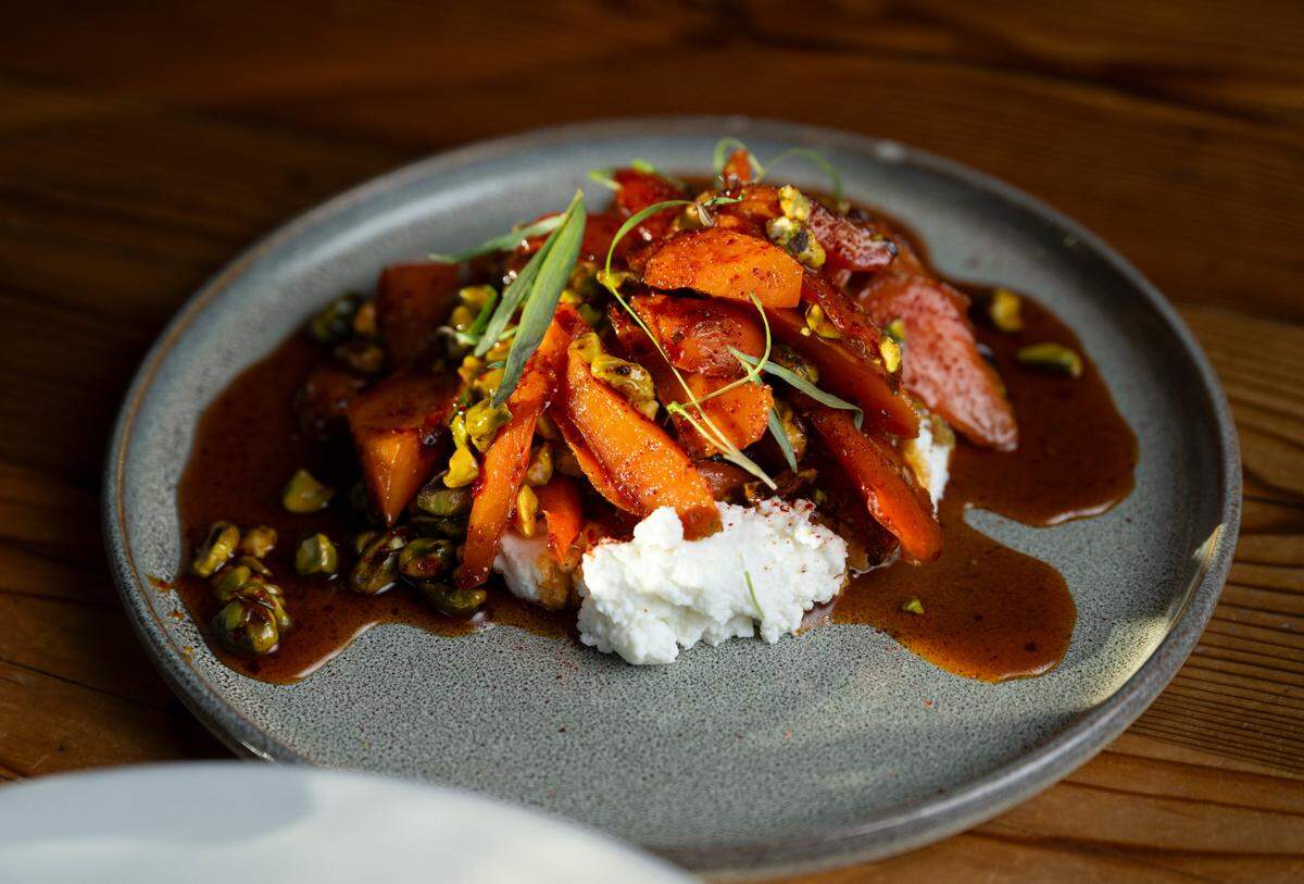 Candied carrots with ricotta, pistachios and espelette honey exemplify The Table’s seasonal ethos.