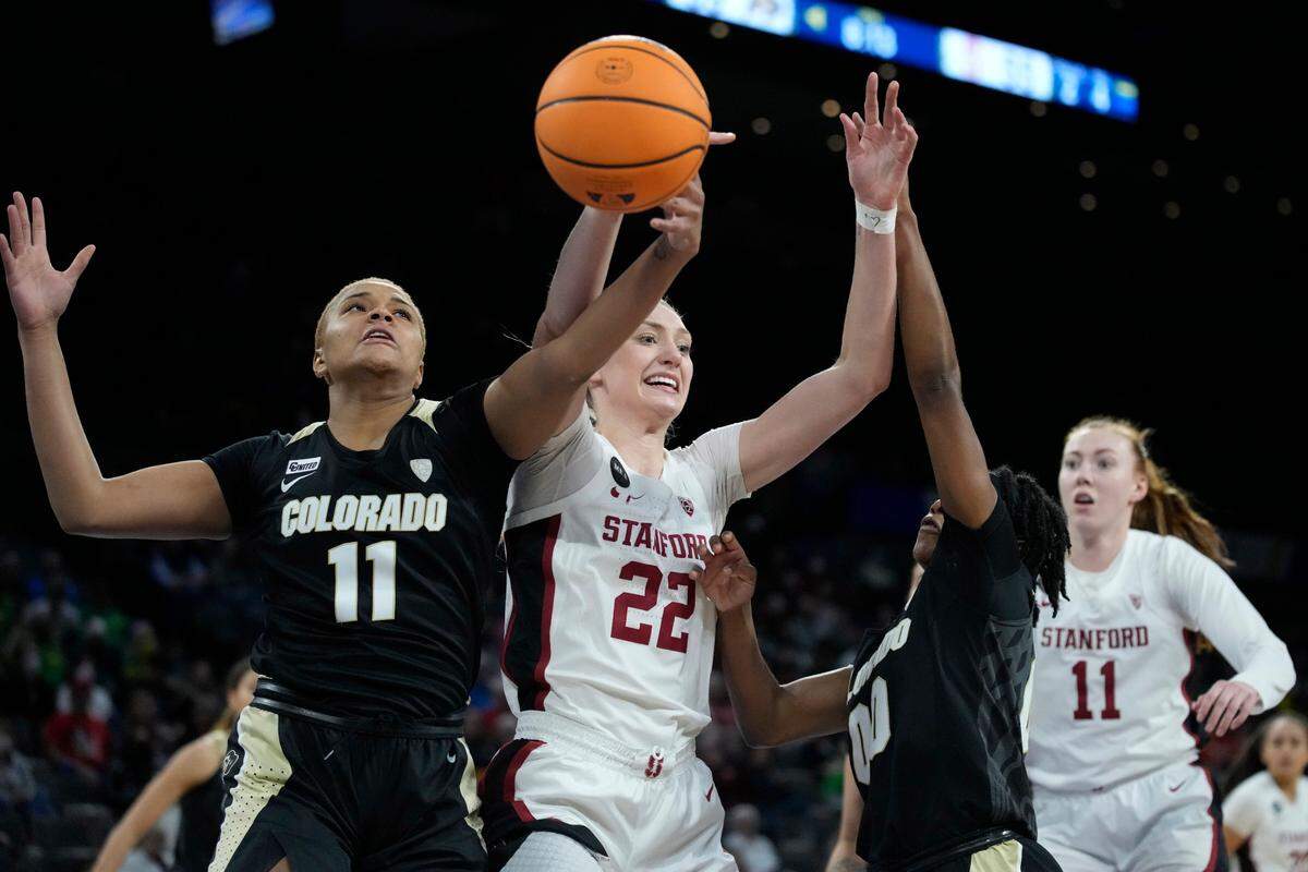 Colorado’s Quay Miller (11) and Stanford’s Cameron Brink (22) battle for a rebound during the second half of an NCAA college basketball game in the semifinal round of the Pac-12 women’s tournament Friday, March 4, 2022, in Las Vegas. (AP Photo/John Locher)