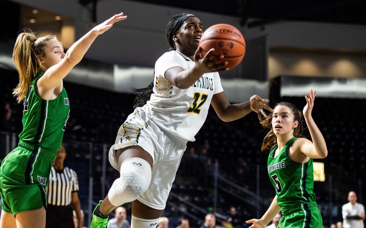 Kentridge’s Jordyn Jenkins (32) drives to the basket in the second quarter. Kentridge played Woodinville in a basketball game at the Showare Center in Kent, Wash., on Monday, Jan. 21, 2019.