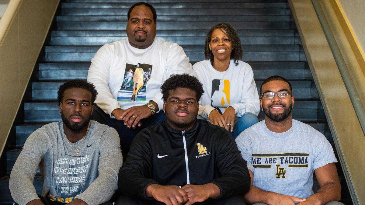 From top left: Nick Simon, LaShonte Simon, Julien Simon, Jayden Simon, and Dionte Simon after a signing ceremony at Lincoln High School in Tacoma, Wash., on Wednesday, Feb. 6, 2019.