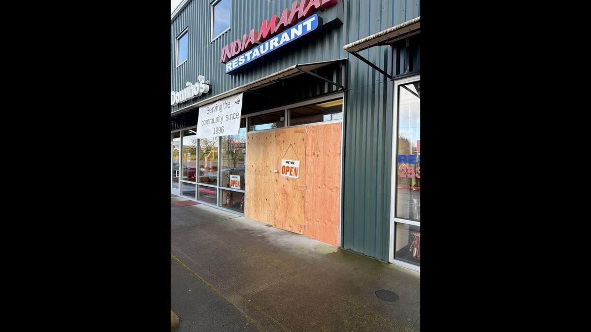 A man attempting to steal a car drove into the India Mahal restaurant in University Place on Saturday, Feb. 7, 2026. The store has since reopened, with a boarded-up front.