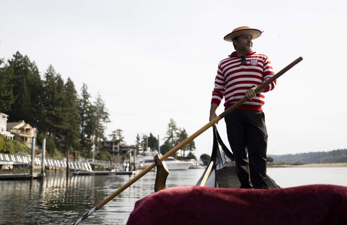 John Synco, owner of Gig Harbor Gondola rows his Venetian gondola, on Thursday, Oct. 9, 2025, in Gig Harbor, Wash. Synco just celebrated 10 years running the one-man gondola tour operation that he describes as a passion.