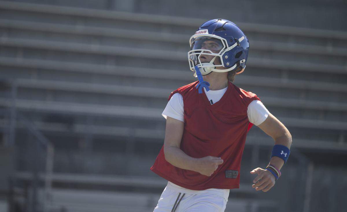 Curtis quarterback Sam Patterson throws during a football practice at Curtis Senior High school on Thursday, Aug. 21, 2025, in University Place, Wash.