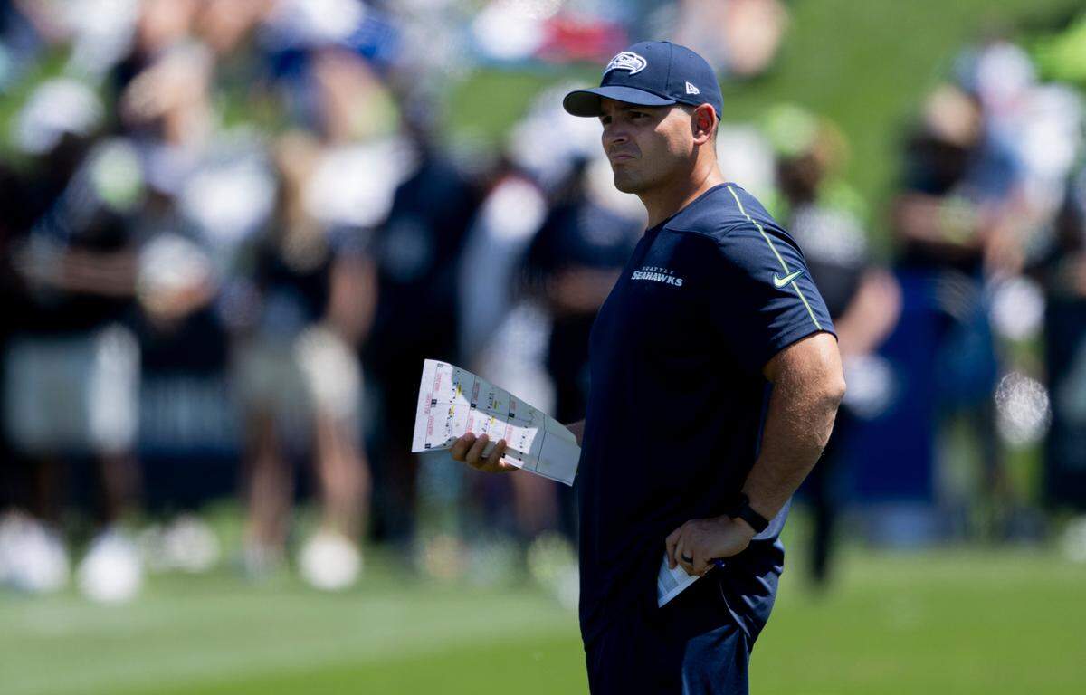 New Seahawks head coach Mike Macdonald watches during the first day of training camp at the Virginia Mason Athletic Center, on Wednesday, July 24, 2024, in Renton.