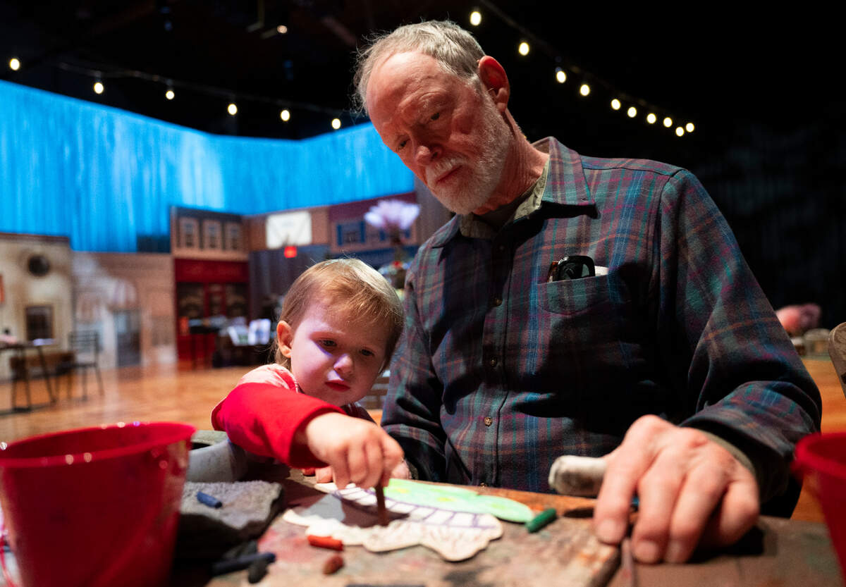 Matthew Flood and granddaughter Annabel Hess, 3, paint and draw Lillies in the section of the exhibition made to look like Monet’s garden during the Imagine Monet experience at the Tacoma Armory, on Thursday, April 4, 2024, in Tacoma, Wash.