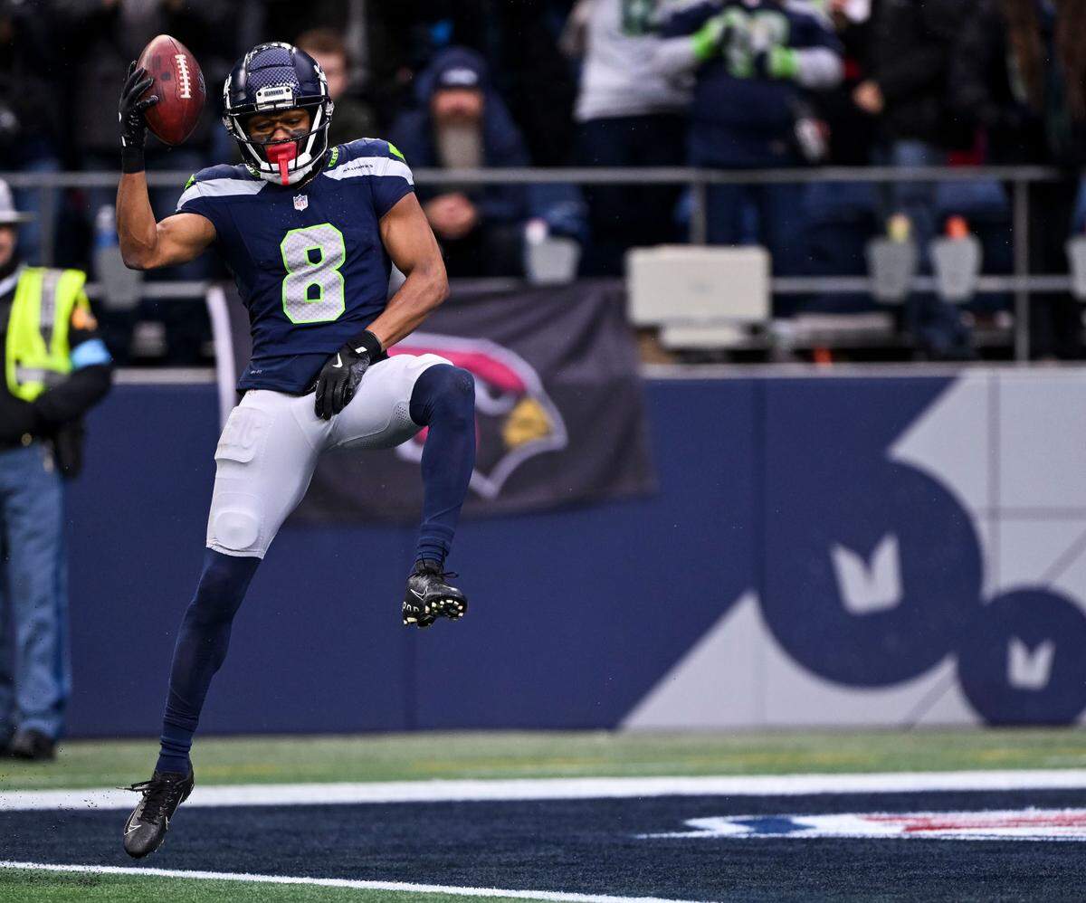 Seattle Seahawks cornerback Coby Bryant (8) leaps into the end zone on a 69-yard interception during the third quarter against the Arizona Cardinals of the game against the Arizona Cardinals at Lumen Field, on Sunday, Nov. 24, 2024, in Seattle, Wash.
