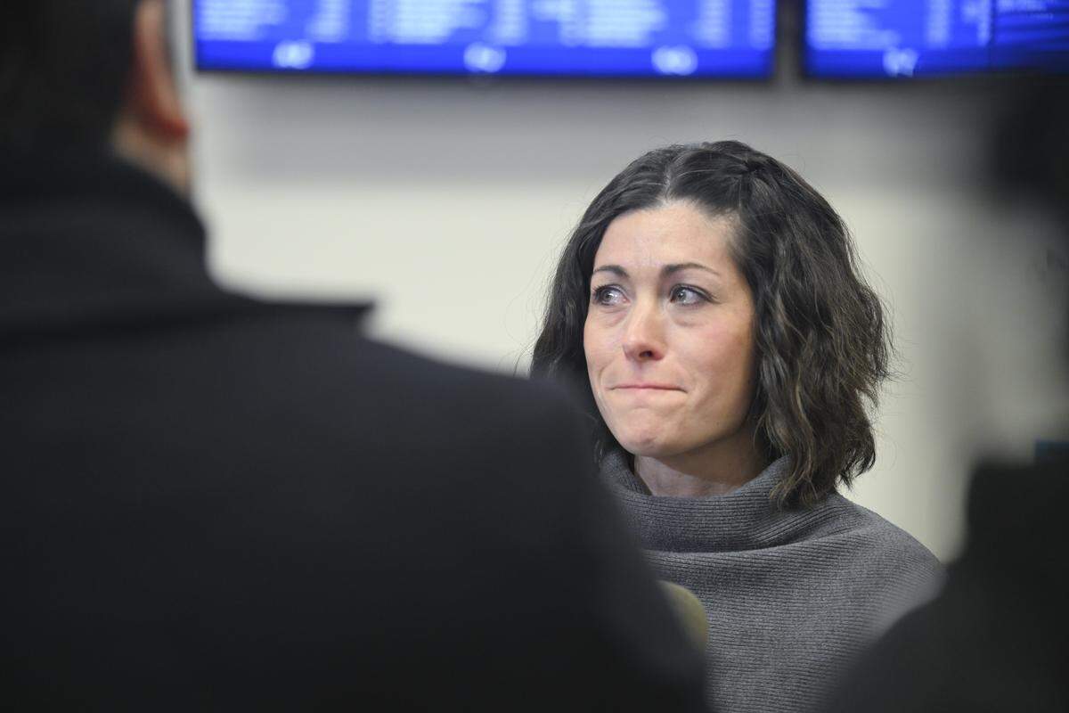 Katie Wakin pauses speaking with the press as tears gather in her eyes after the arraignment of James Robert Randle on Thursday, April 2, 2026, at Pierce County Superior Court in Tacoma. Randle has been charged with first-degree murder for allegedly killing his estranged wife and Wakin's mother, Janice Randle.