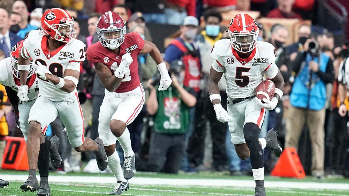 Georgia’s Kelee Ringo returns an interception for a touchdown during the second half of the College Football Playoff championship football game against Alabama Monday, Jan. 10, 2022, in Indianapolis.