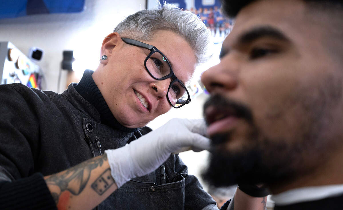 Barber Georgette Watje works on client Aether Kertzen of Tacoma at The Barber Collective in downtown Tacoma, Washington, on Thursday, March 7, 2024.