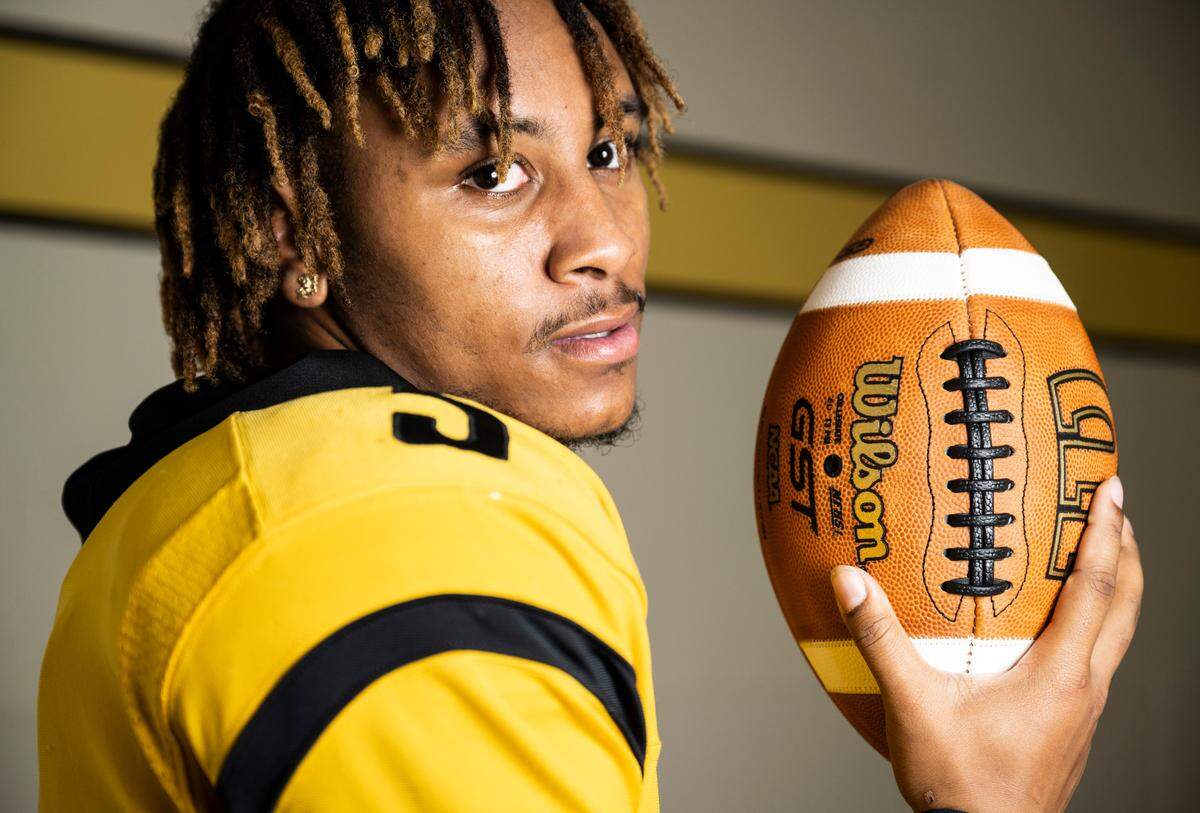 Lincoln senior and varsity football quarterback Gabarri Johnson poses for a portrait after being selected as the player of the year for The News Tribune’s 2022 All-Area football team, at Lincoln High School in Tacoma, Wash. on Dec. 8, 2022.
