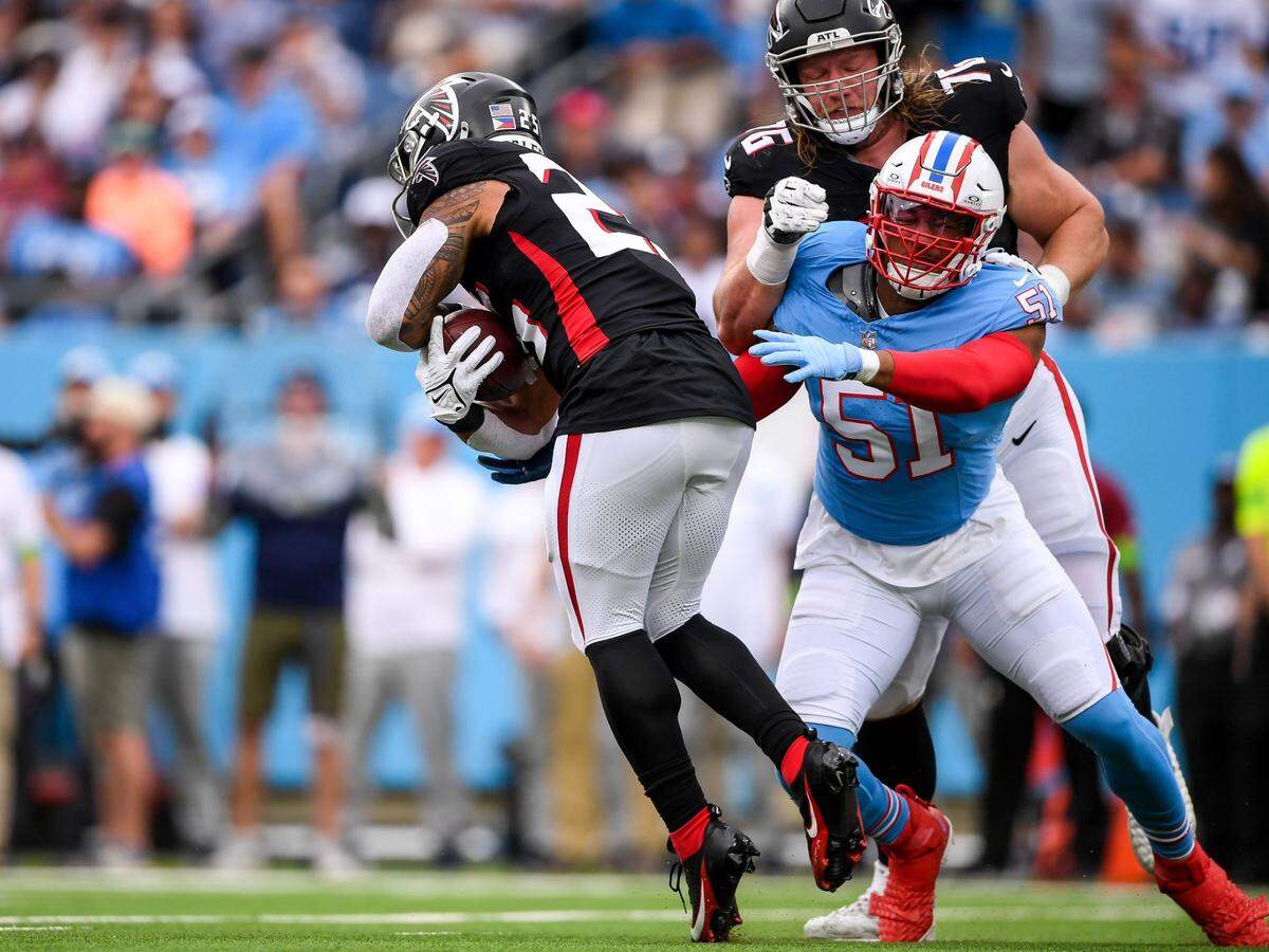 Oct 29, 2023; Nashville, Tennessee, USA; Tennessee Titans linebacker Trevis Gipson (51) tackles Atlanta Falcons cornerback Dee Alford (20) during the first half at Nissan Stadium. Mandatory Credit: Steve Roberts-USA TODAY Sports