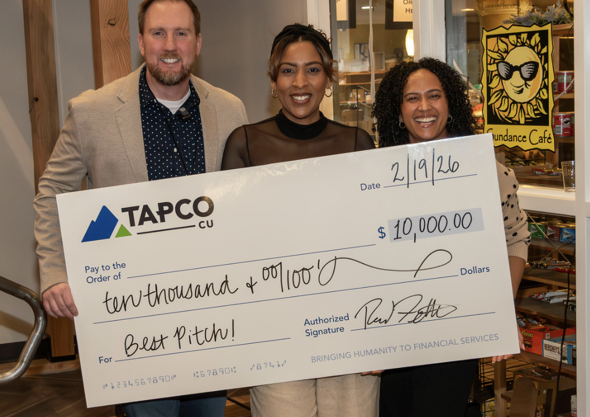 Reid Fetters (left) of Tacoma Rising is seen with Sam De La Cruz (middle) and Cherise Klosner after De La Cruz and Klosner’s business, Sign and Celebrate, won a business entrepreneur competition.