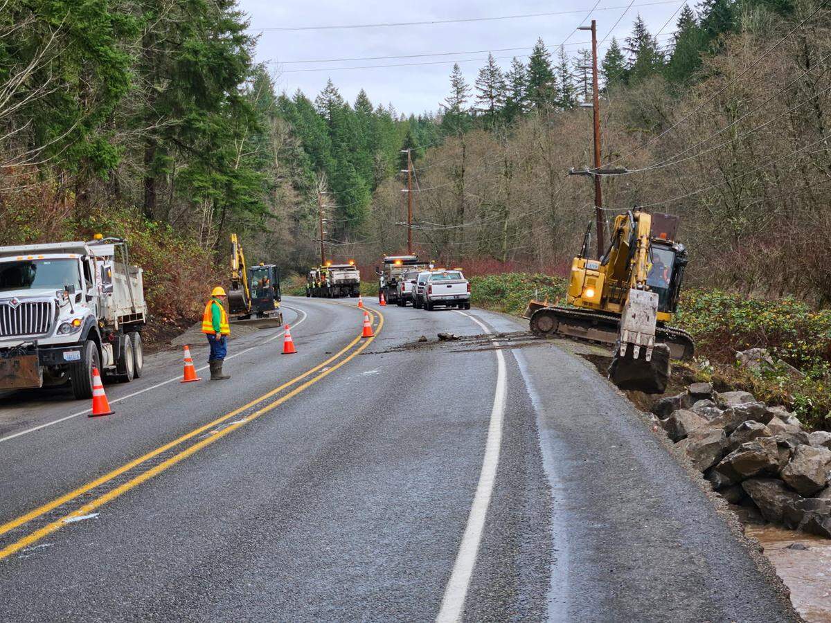 Washington State Department of Transportation crews put up an emergency lane on SR 410 to reduce weight on the damaged roadway in Pierce County.