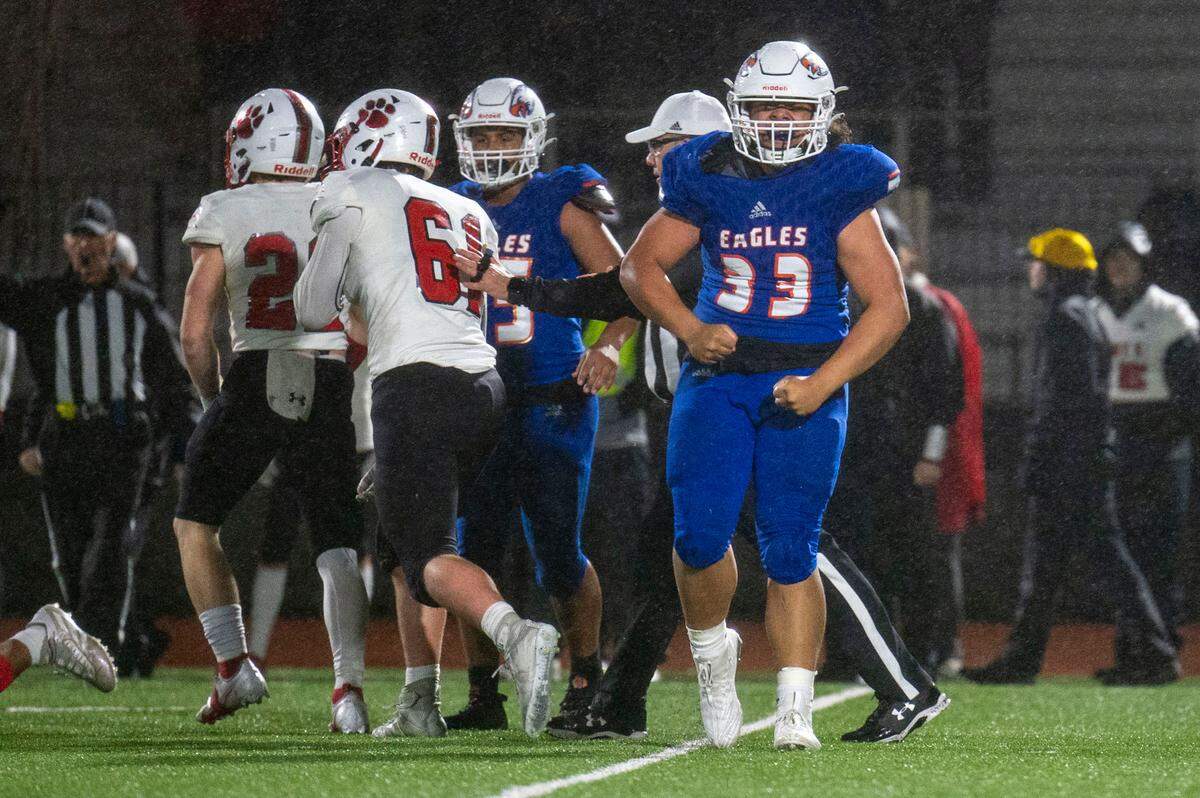 Graham-Kapowsin’s Michael Toa celebrates after helping to take down Mount Si running back Jesiah Willis in the backfield during the second quarter of a Week 10 playoff game on Friday, Nov. 4, 2022, at Art Crate Field in Spanaway, Wash.