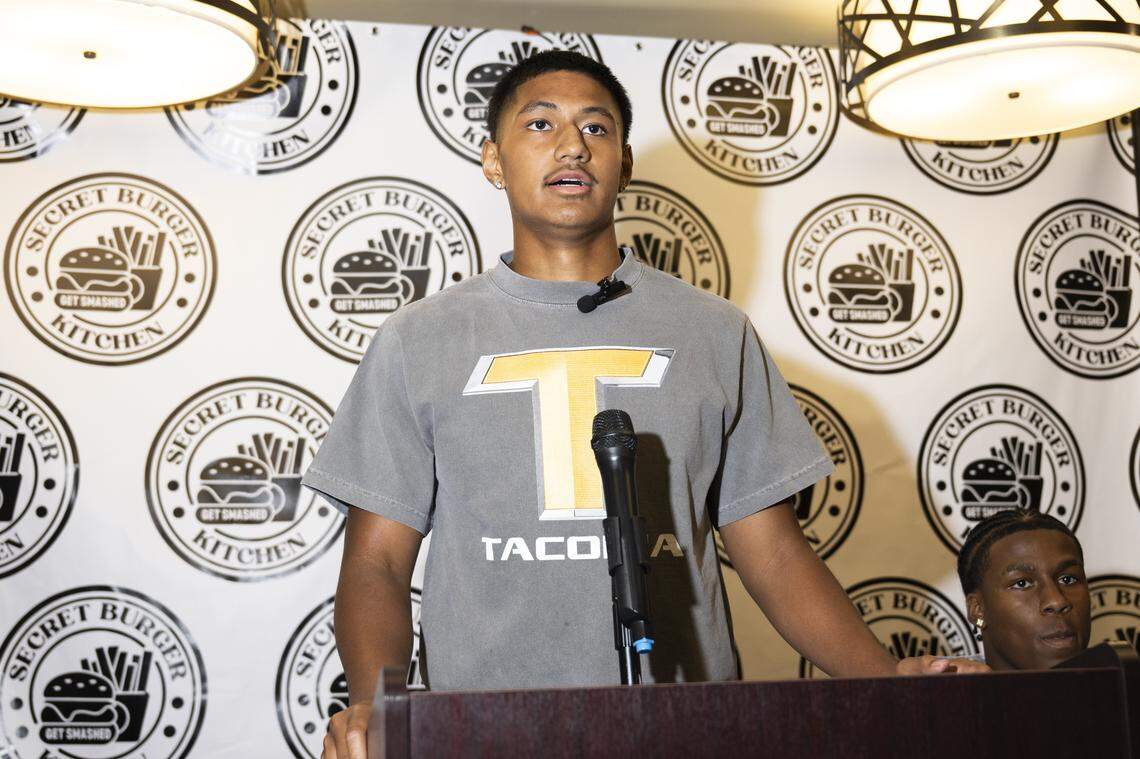 Lincoln quarterback Sione Kaho speaks after signing a NIL deal with Secret Burger Kitchen, on Wednesday, Aug. 13, 2025, in Tacoma, Wash.