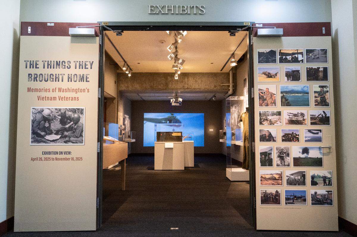 The doors to “The Things They Brought Home,” a new exhibit at the Washington State History Museum stand open on Thursday, April 24, 2025, in Tacoma, Wash. The exhibit showcases the stories of Washington’s Vietnam War veterans by displaying a collection of personal objects that people brought back from their service.
