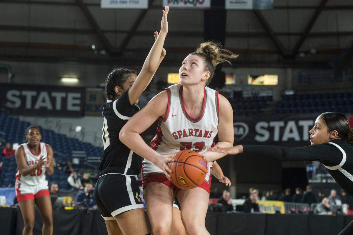 Stanwood forward Vivienne Berrett (53) looks to shoot in the third quarter against Lynnwood in the opening round of the Class 3A girls state basketball tournament on Wednesday, March 1, 2023 at the Tacoma Dome in Tacoma, Wash.
