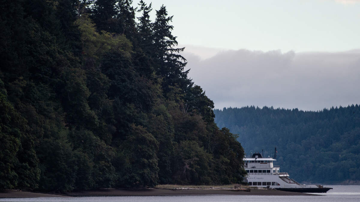 The Pierce County ferry makes a stop at Ketron Island to unload emergency personnel Saturday morning. The ferry service has been suspended for all, except for emergency responders and investigators, to Ketron Island until further notice. Ferry service to Anderson Island will operate as close to schedule as possible Saturday, Pierce County officials said. Photographed near Tacoma, Wash., on Saturday, Aug. 11, 2018.