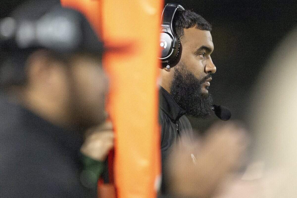 Puyallup head coach DJ Mims stands on the sidelines during a game against Emerald Ridge on Friday, Sept. 26, 2025, in Puyallup, Wash.