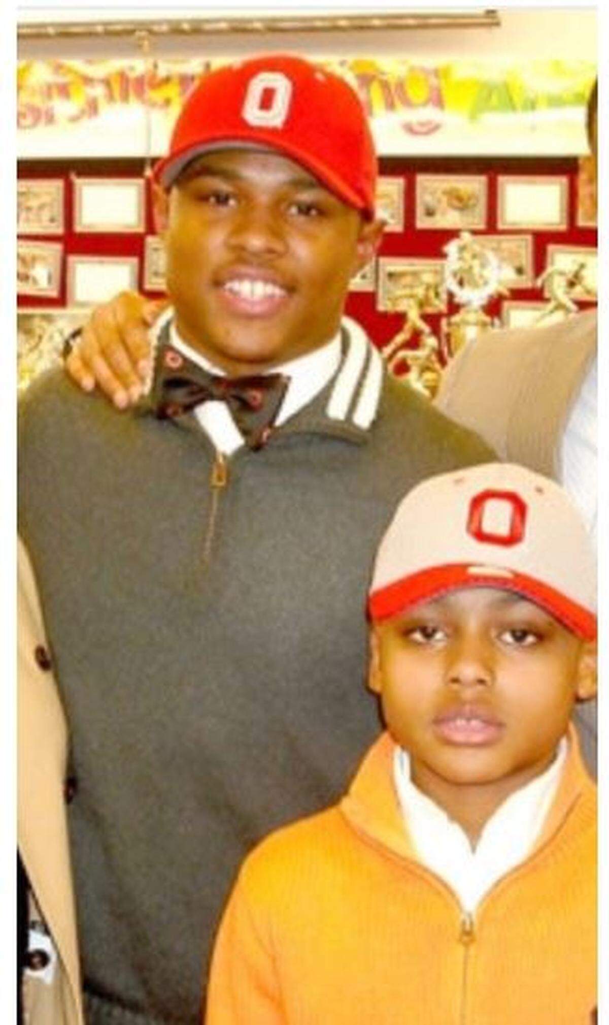Christian Bryant (left) and his younger brother by seven years Coby on the day in 2010 Christian signed to play at Ohio State out of Glenville High School in their hometown of Cleveland.