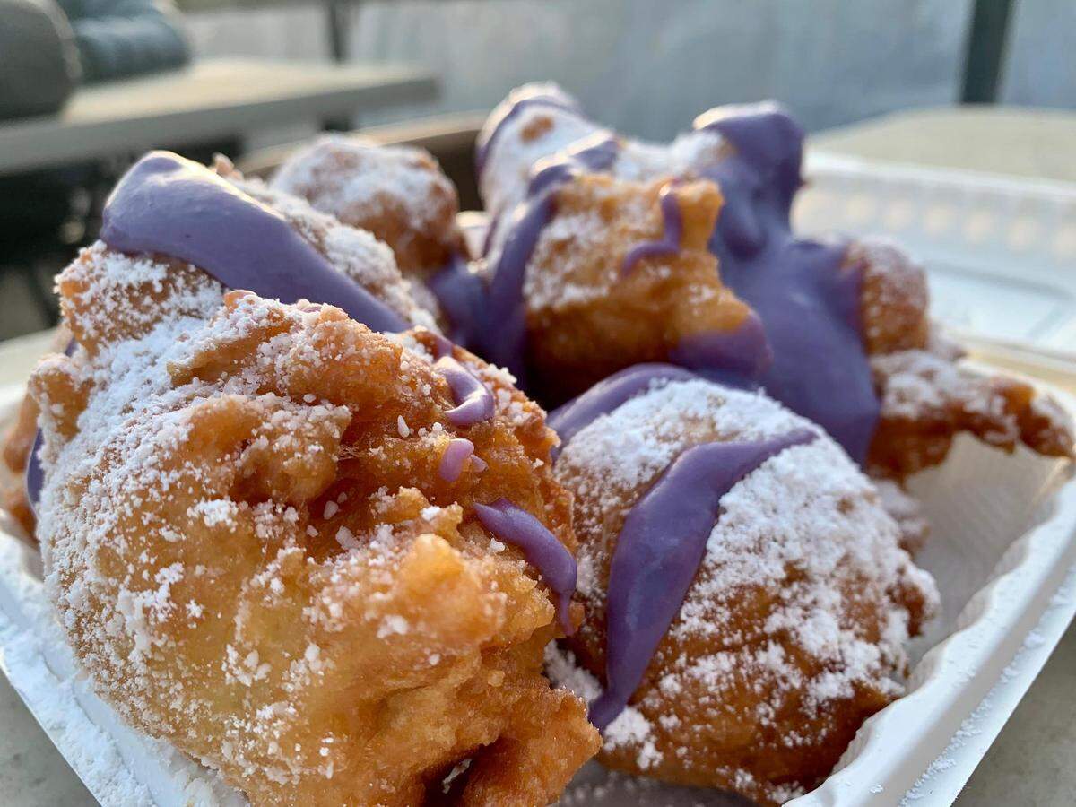 At Reyna Filipina Kitchen, expect fresh Filipino food and modern brunch spins -- as in these beignets, fried to order and drizzled with ube sauce and powdered sugar.