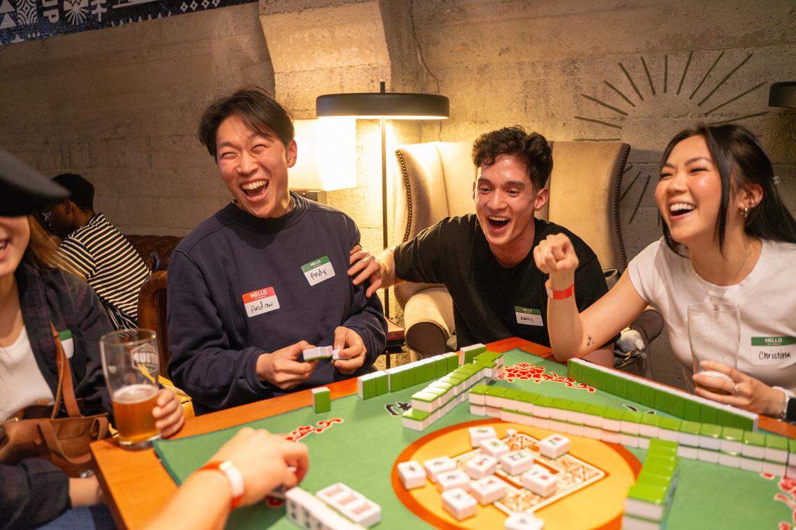 Mahjong players enjoy a game at Emerald City Tile Club, a mahjong social club in Seattle, Wash.