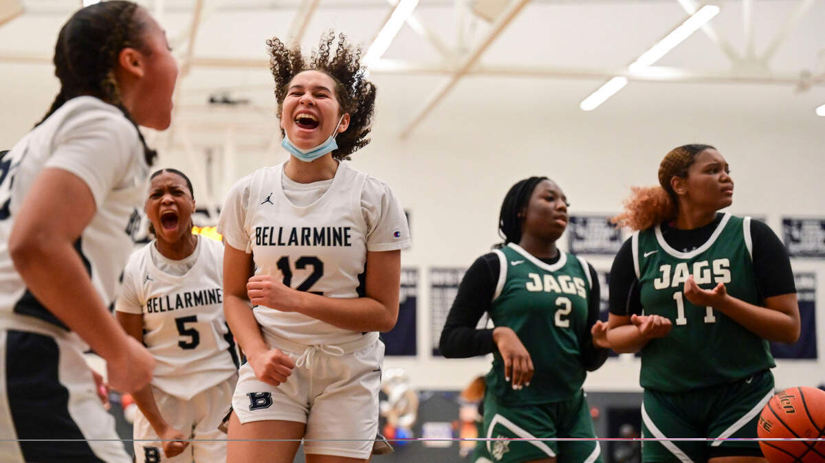 Bellarmine Prep forward Stella Wiggins (12) and guard Kiara Stone (5) celebrate after guard Jada Travis (23) was fouled while making a layup as Emerald Ridge guard Kali Haizlip (2) and guard Marecia Barnett (11) look toward the referee for an explanation during the second quarter of a 4A South Puget Sound League game on Friday, Jan. 28, 2022, at Bellarmine Prep, in Tacoma, Wash.