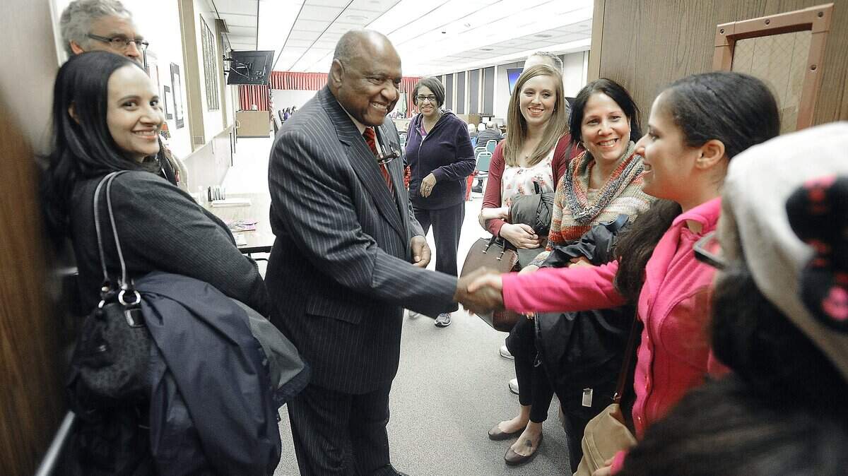 Willie Stewart greets students and well-wishers on Feb. 26, 2015, after the Tacoma School District renamed the Reengagement Center the Willie Stewart Academy in honor of his decades of service. A scholarship in his name is accepting applications.
