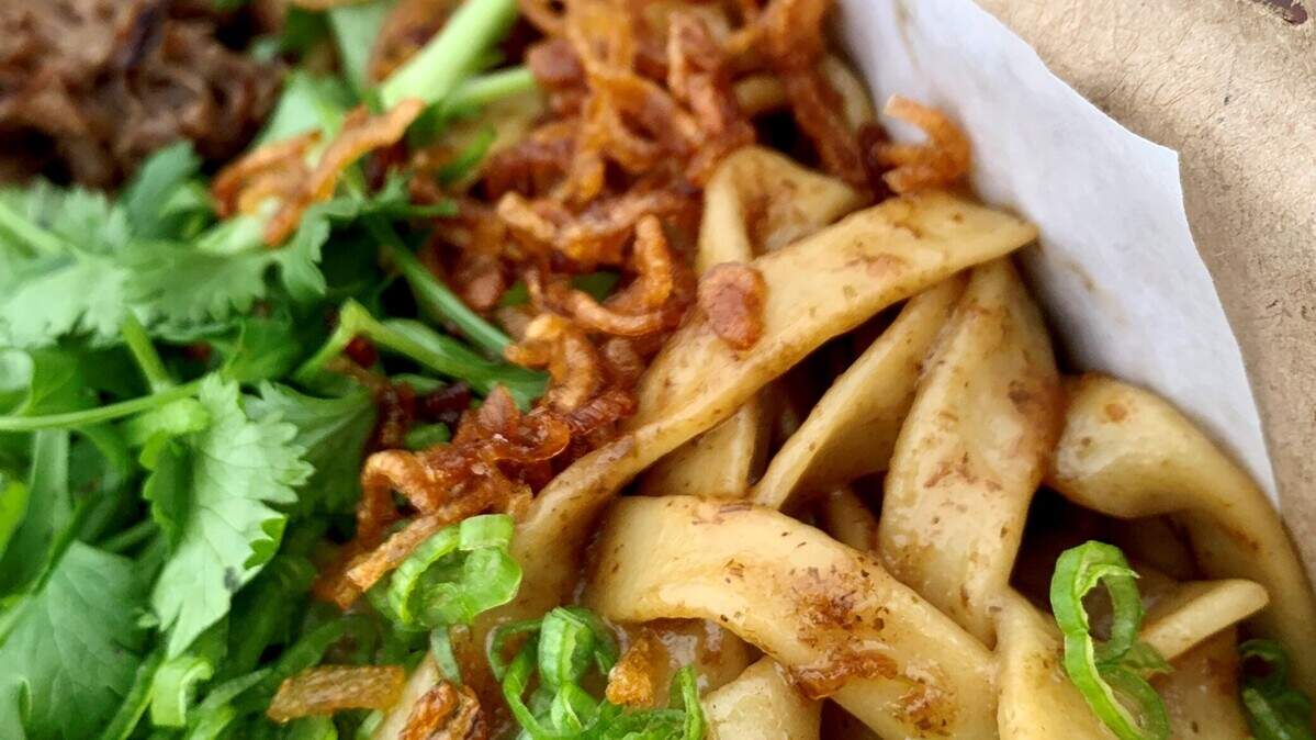 The knife-cut noodles are the star of Mogoso Noodles, a food stand at the Tacoma Farmers Market on Broadway. Owners June Yoon and Sun Lee hope to open a brick-and-mortar restaurant.