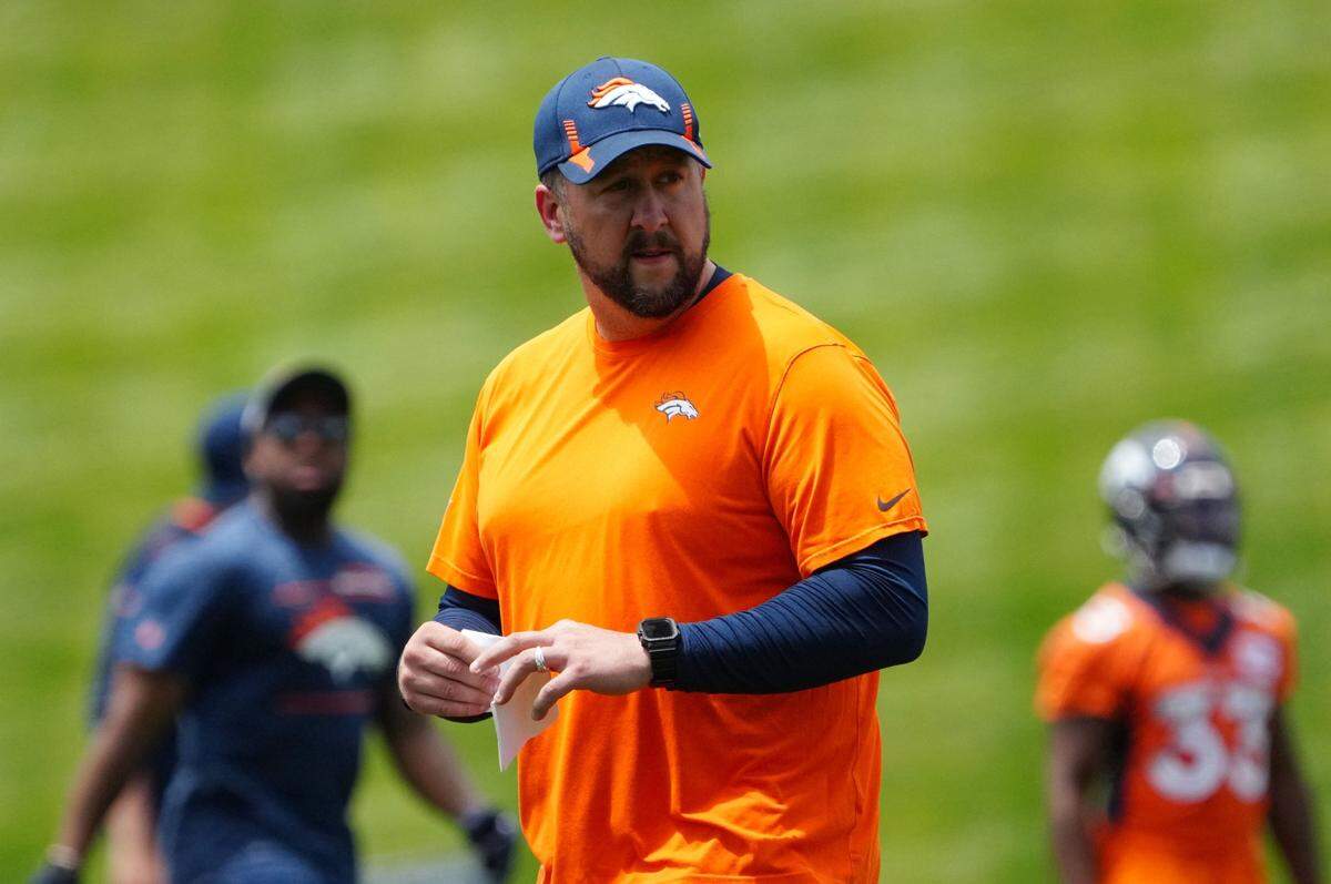 Jun 6, 2022; Englewood, Colorado, USA; Denver Broncos offensive coordinator Justin Outten during OTA workouts at the UC Health Training Center. Mandatory Credit: Ron Chenoy-USA TODAY Sports