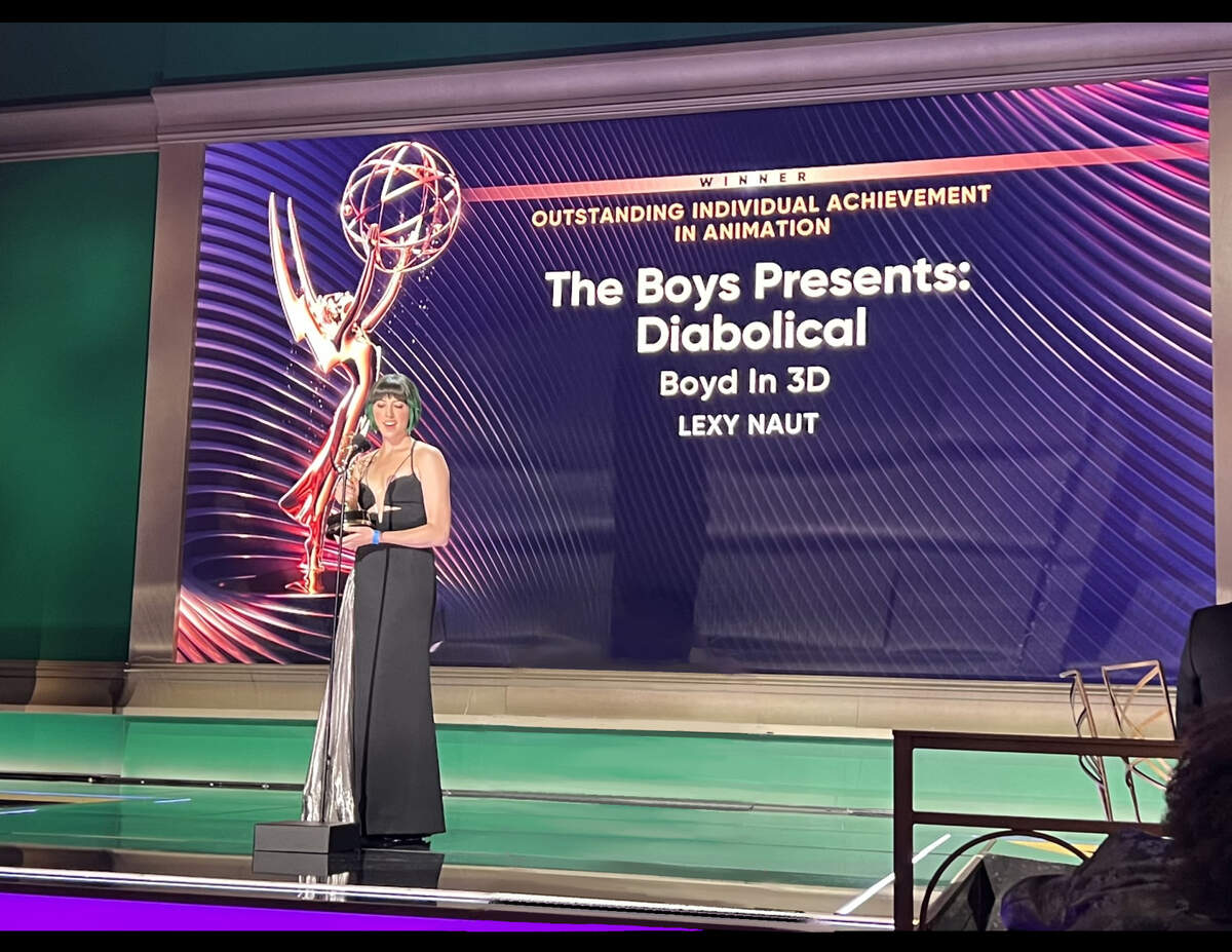 Lexy Naut accepts her Emmy Award.