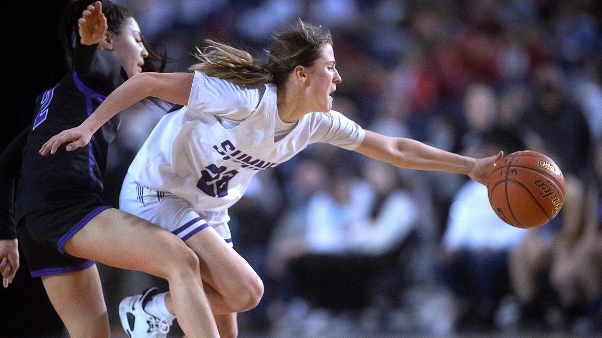 Sumner’s Lainee Houilloon beats Pasco’s Leanna Lepe in a race to a loose ball during Friday evening’s semifinal game of the WIAA 4A Girls Basketball State Championships tournament in the Tacoma Dome in Tacoma, Washington, on Friday, March 4, 2022.