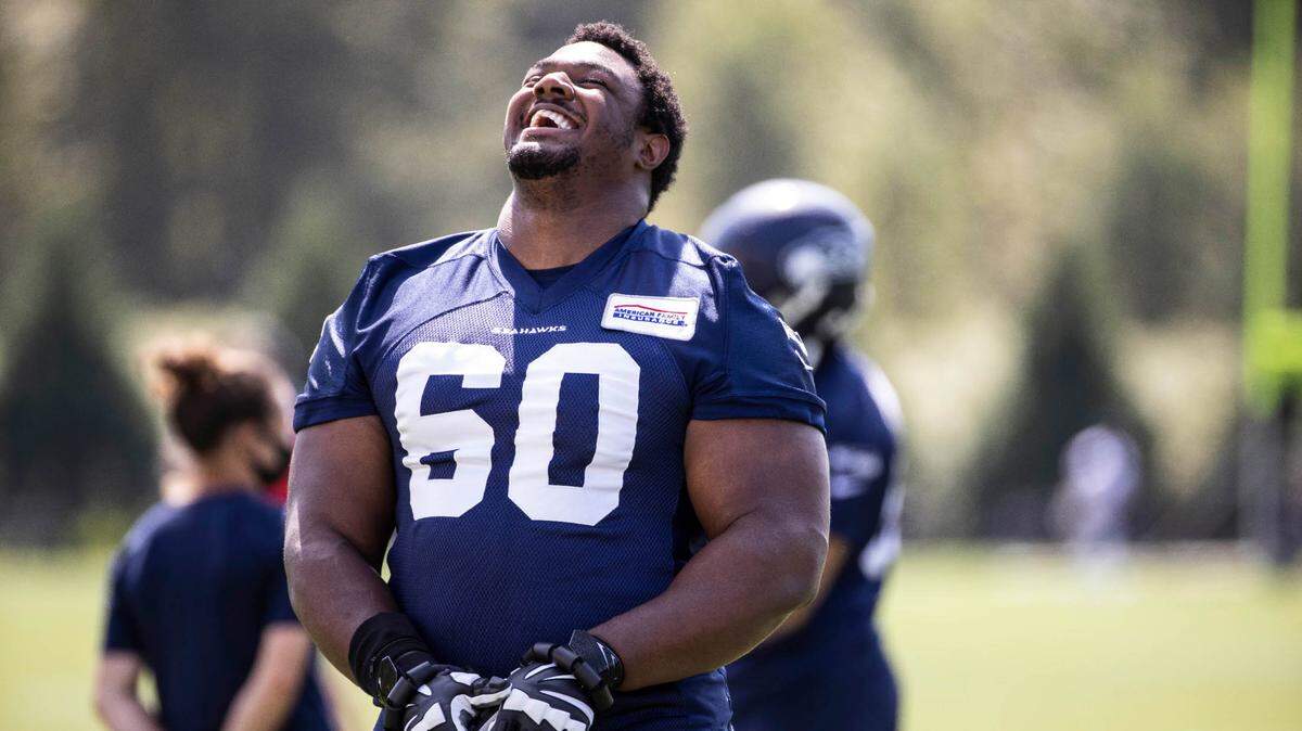 Seahawks guard Phil Haynes lets out a roar of laughter as he warms up for Thursday’s practice. The Seattle Seahawks practiced Thursday, August 13, 2020 at the VMAC in Renton, WA.