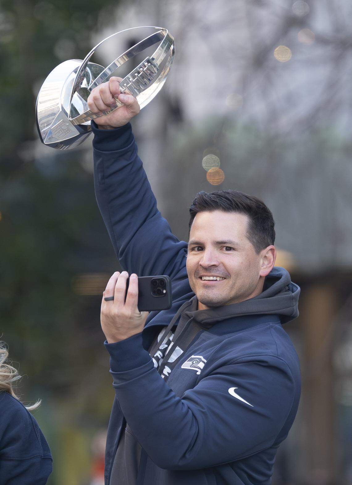 Seahawks head coach Mike Macdonald raises the George Halas NFC Championship Trophy during the Super Bowl victory parade on Wednesday, Feb. 11, 2026, in downtown Seattle.