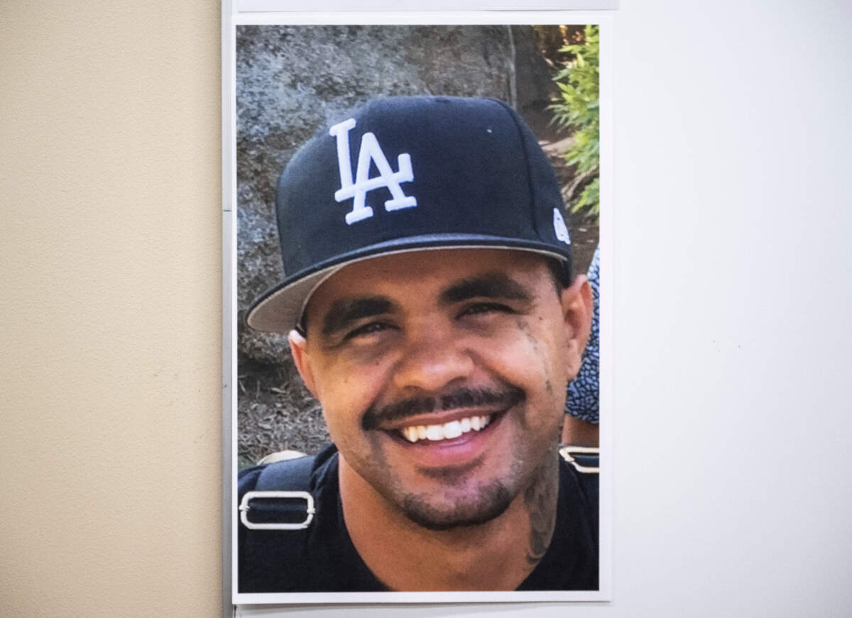 An image of Jordan Patterson, 31, hangs on a wall during an on-camera briefing asking people to come forward with information regarding his unsolved murder that occurred on Dec. 31, 2021 where he was found with a gunshot wound to the head near the 300 block of North D Street, at the Tacoma Police Department Headquarters in Tacoma, Wash. on Feb. 9, 2023.