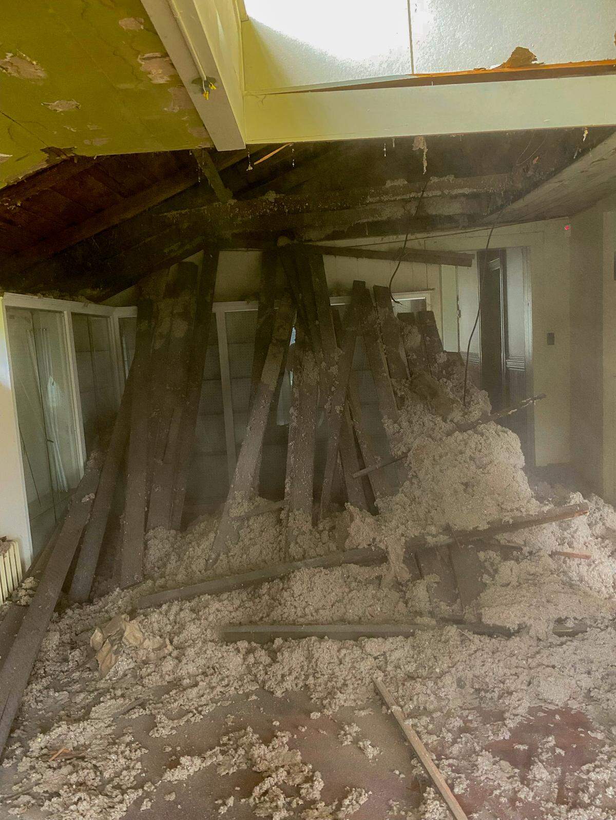 The ceiling of the cabin space at the Ryan House in Sumner, Wash., fell to the floor. The attic had tongue and groove flooring.
