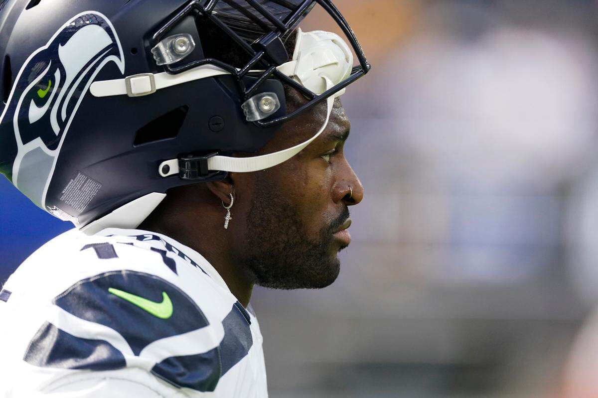 Seattle Seahawks wide receiver DK Metcalf (14) warms up before an NFL football game against the Los Angeles Chargers Sunday, Oct. 23, 2022, in Inglewood, Calif. (AP Photo/Mark J. Terrill)