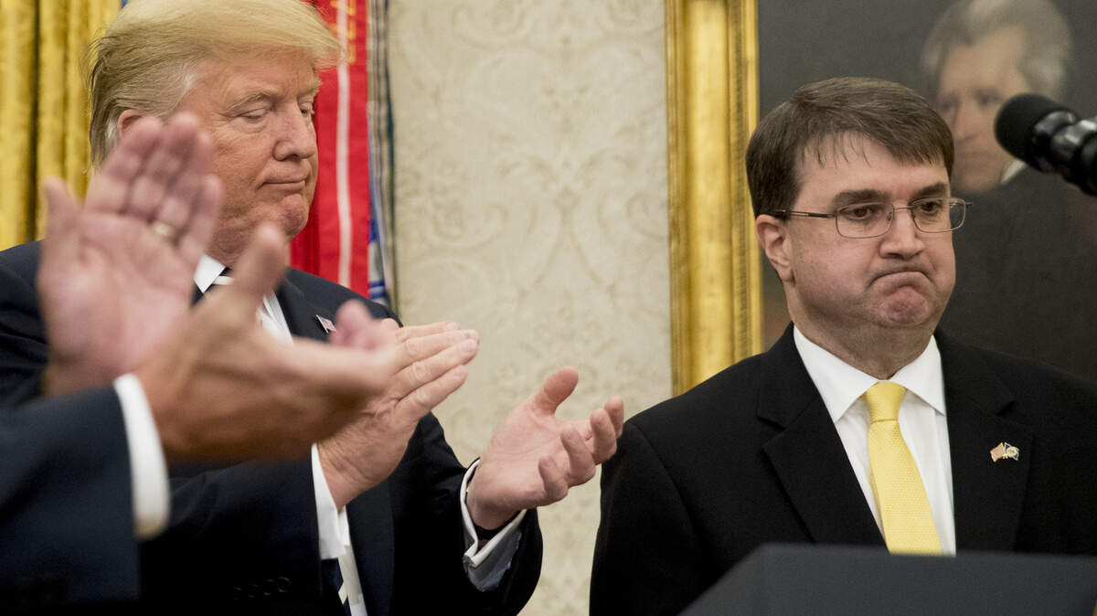 President Donald Trump, left, applauds as Robert Wilkie speaks before he is sworn in as the new Secretary of the Department of Veterans Affairs during a ceremony in the Oval Office of the White House, Monday, July 30, 2018, in Washington.