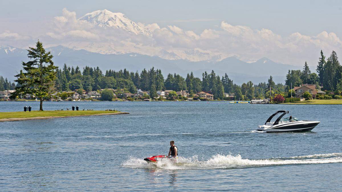 Lake Tapps is seen here in May 2014. Crowds at a popular lakeshore park have prompted parking restrictions.