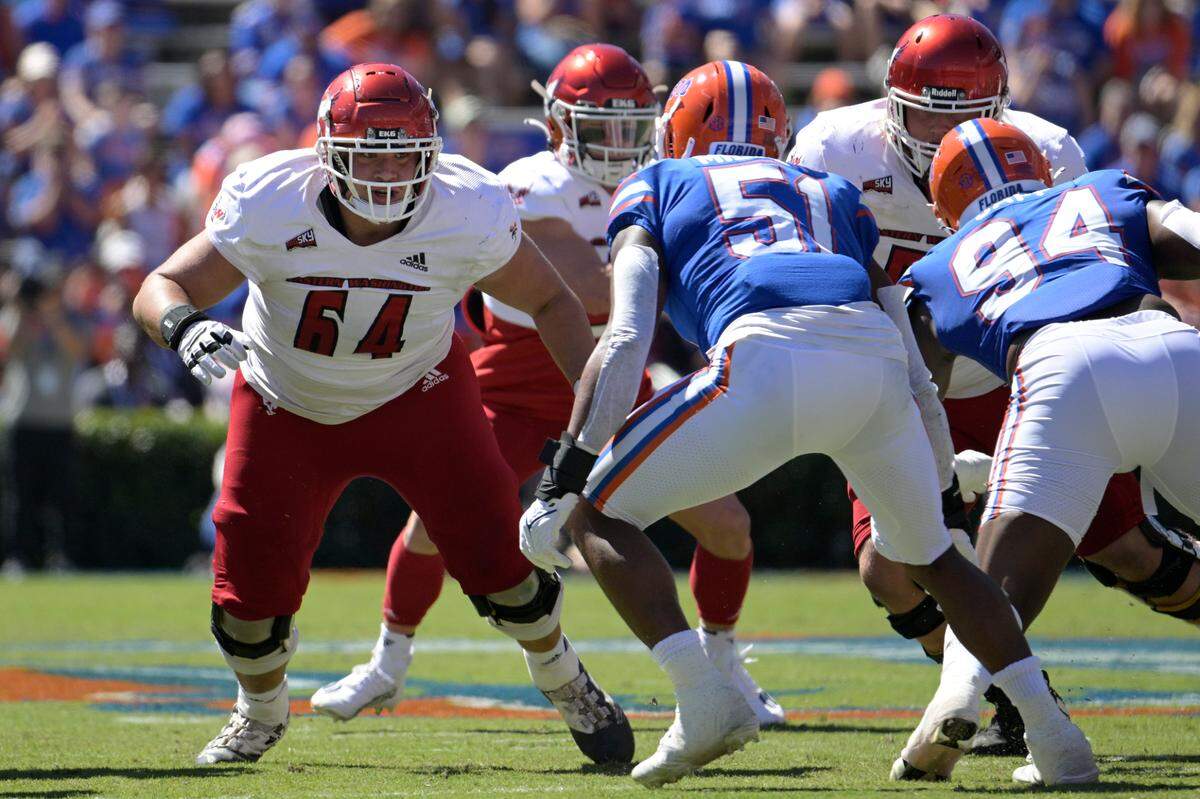 Eastern Washington offensive lineman Brenden Rivera (64) sets up to block against Florida linebacker Ventrell Miller (51) during the first half of an NCAA college football game, Sunday, Oct. 2, 2022, in Gainesville, Fla. (AP Photo/Phelan M. Ebenhack)