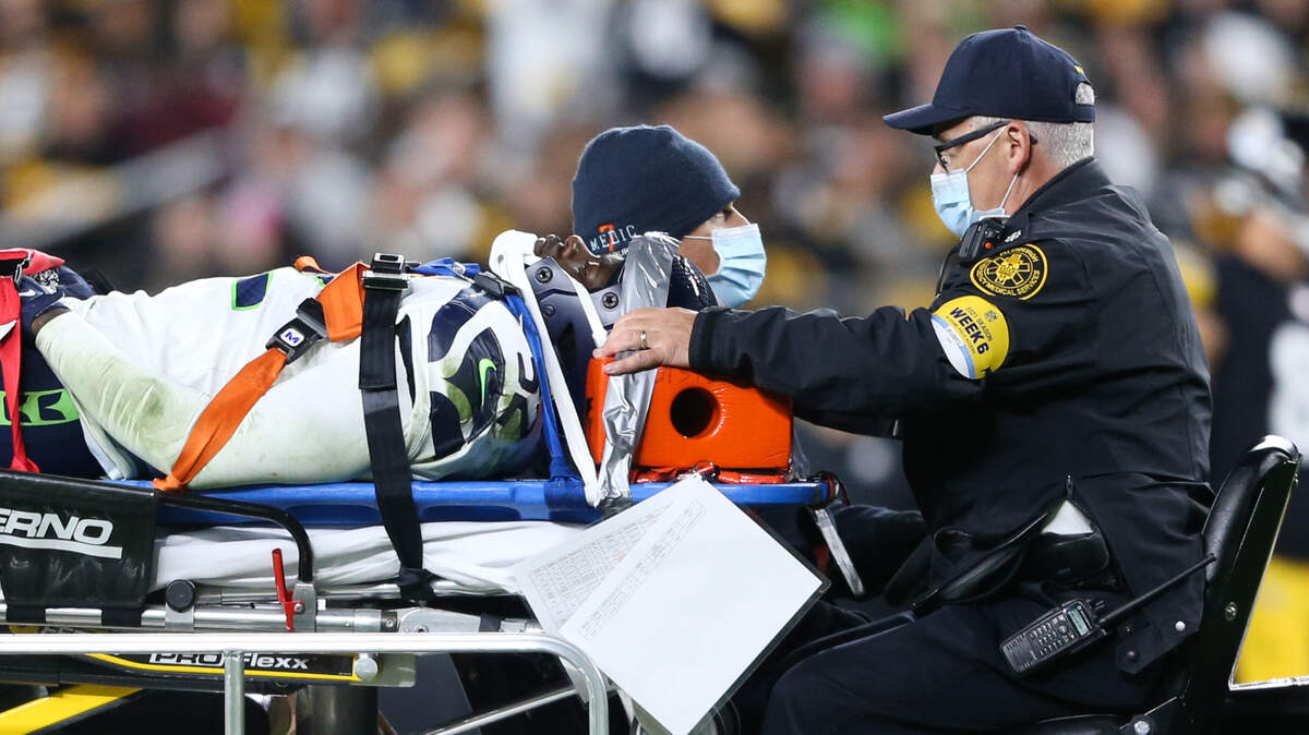 Seattle Seahawks defensive end Darrell Taylor (52) is carted off the file during the fourth quarter. The Seattle Seahawks played the Pittsburgh Steelers at Heinz Field in Pittsburgh, Pa., on Sunday, Oct. 17, 2021.