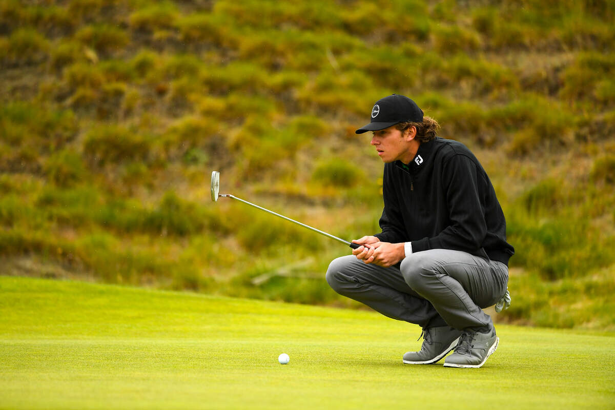 Palmer Jackson lines his putt up on the sixth hole during the round of 32 at the 2021 U.S. Amateur Four-Ball at Chambers Bay in University Place, Wash. on Monday, May 24, 2021. (Robert Beck/USGA)