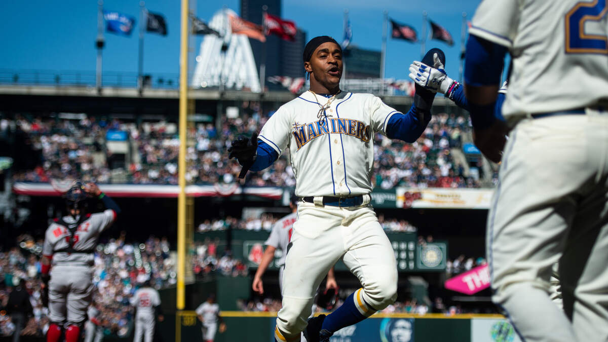 Centerfielder Mallex Smith celebrates after crossing the plate for a run in the third inning. The Seattle Mariners played the Boston Red Sox in a Major League Baseball Game at T-Mobile Park in Seattle, Wash., on Sunday, March 31, 2019. 
