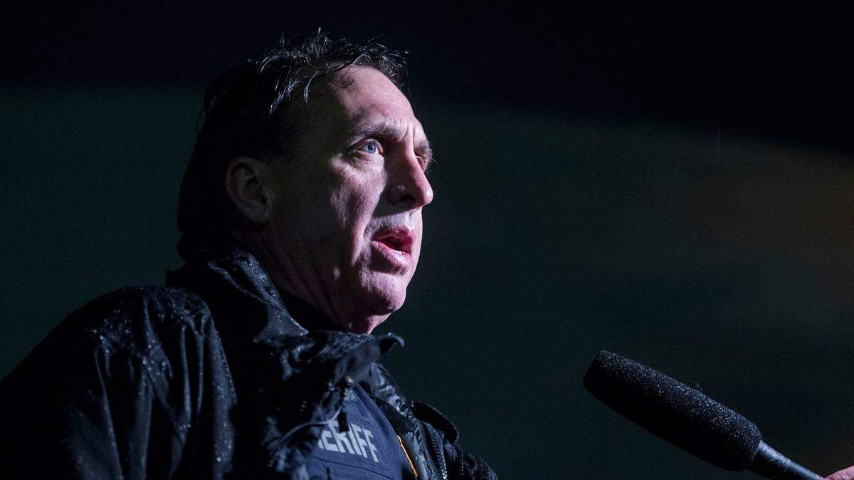 Officer Ed Troyer speaks to media as police wait inside St. Joseph’s Hospital following an officer-involved shooting in Spanaway in this 2018 file photo.