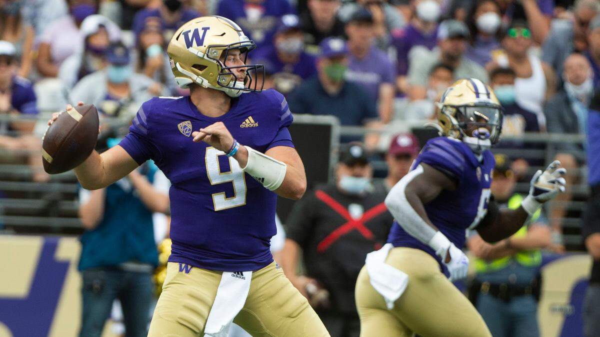 UW quarterback Dylan Morris prepares to throw as running back Richard Newton watches. The Washington Huskies played the Montana Grizzlies at Husky Stadium in Seattle, Wash., on Saturday, Sept. 4, 2021.