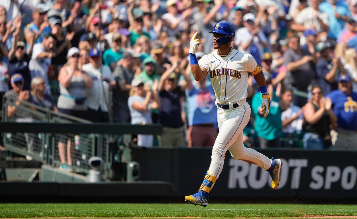 Seattle Mariners’ Julio Rodriguez jogs the bases after hitting a two-run home run to score Josh Rojas against the Kansas City Royals during the fifth inning of a baseball game, Sunday, Aug. 27, 2023, in Seattle. (AP Photo/Lindsey Wasson)