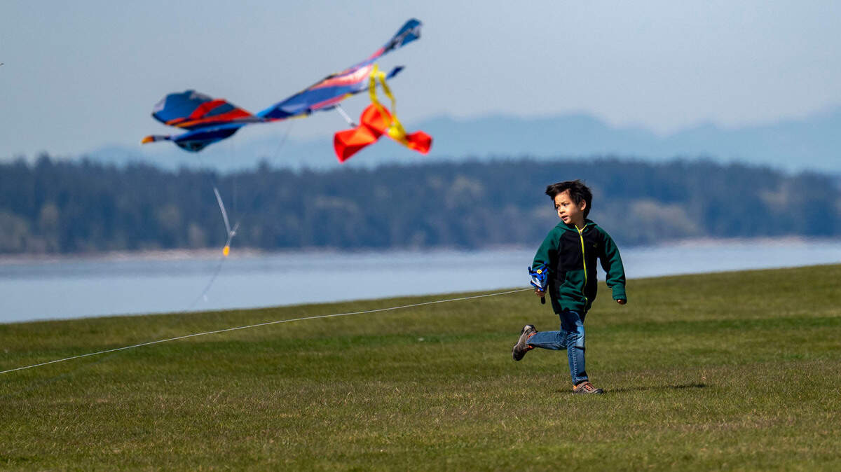 Desmond Sanborn, 5, of DuPont, attempts to get his kit flying while at Chambers Creek Regional Park on a Wednesday, April 7, 2022, in University Place.