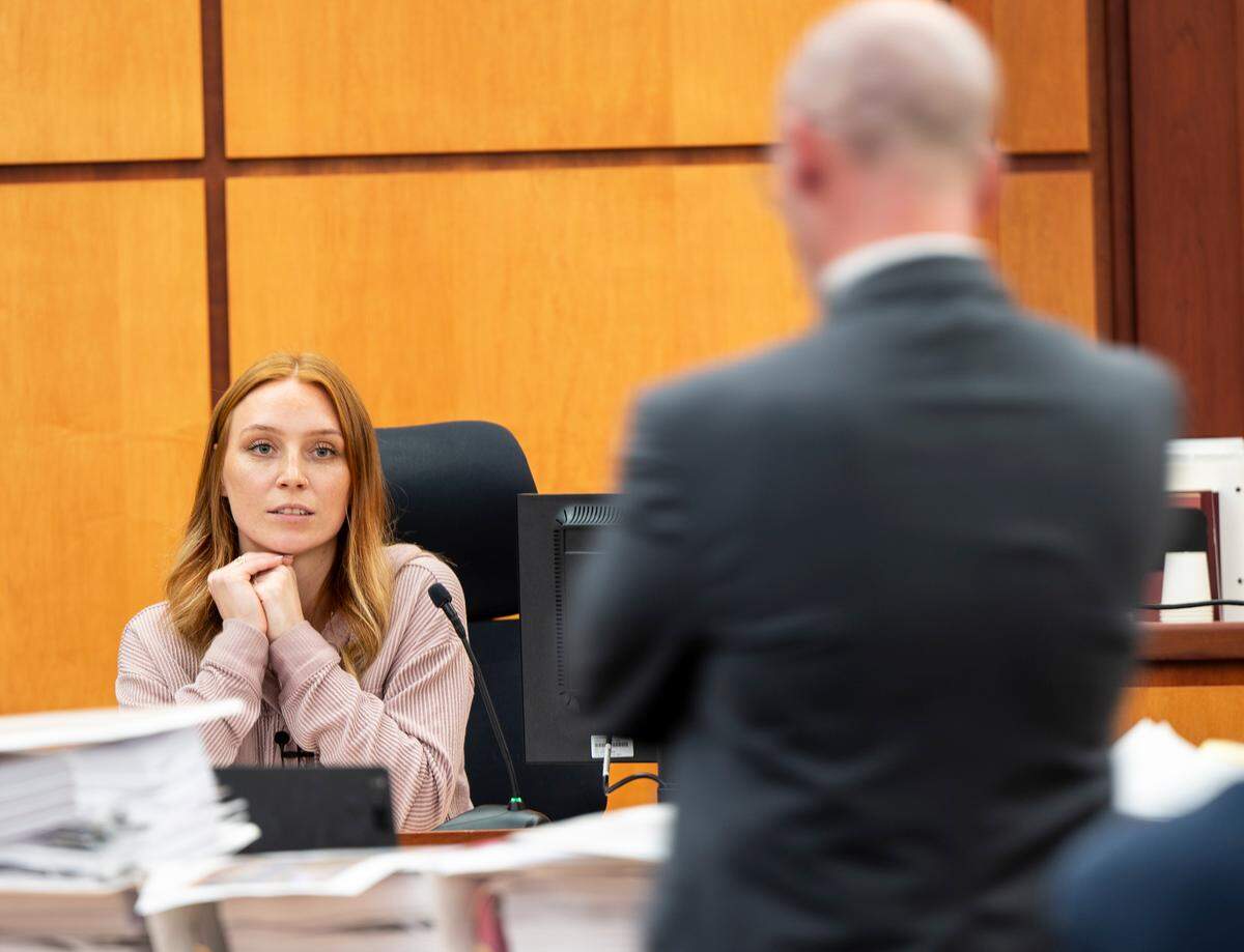 Sara McDowell is question on cross-examination by defense attorney Jared Ausserer during the trial of Tacoma Police Officers Christopher Burbank, Matthew Collins and Timothy Rankine in the killing of Manny Ellis at Pierce County Superior Court, Tuesday, Oct. 10, 2023, in Tacoma, Wash. (Brian Hayes / Pool Photo – The News Tribune)